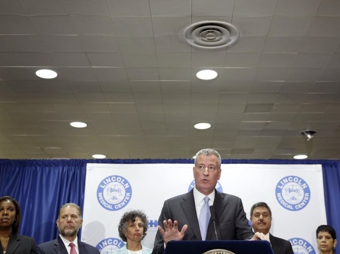 New York City Mayor Bill de Blasio speaks to reporters during a news conference at Lincoln Hospital in the Bronx borough of New York, Tuesday, Aug. 4, 2015. Officials have traced the likely cause of the outbreak of Legionnaires' Disease to cooling towers, which can release mist. (AP Photo/Seth Wenig)