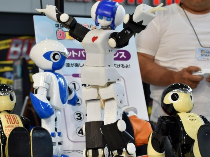 Robot 'Premaid AI' (C) created by Japanese company DMM.make ROBOTS is displayed at a robot event for children in Tokyo on August 9, 2015. The robot event 'Wakudoki (Exciting) Robot Park' runs to August 14 at Toyota Motor exhibition showroom Mega Web. AFP PHOTO / KAZUHIRO NOGI