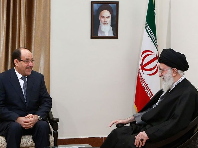 A handout picture released by the official website of Iran's supreme leader, Ayatollah Ali Khamenei, shows him (R) meeting with Iraqi Prime Minister Nuri al-Maliki in Tehran on December 5, 2013. Maliki arrived in Iran, state television reported, for two days of talks that will also focus on the conflict raging in Syria. AFP PHOTO/ KHAMENEI.IR === RESTRICTED TO EDITORIAL USE - MANDATORY CREDIT "AFP PHOTO / KHAMENEI.IR" - NO MARKETING NO ADVERTISING CAMPAIGNS - DISTRIBUTED AS A SERVICE TO CLIENTS ===