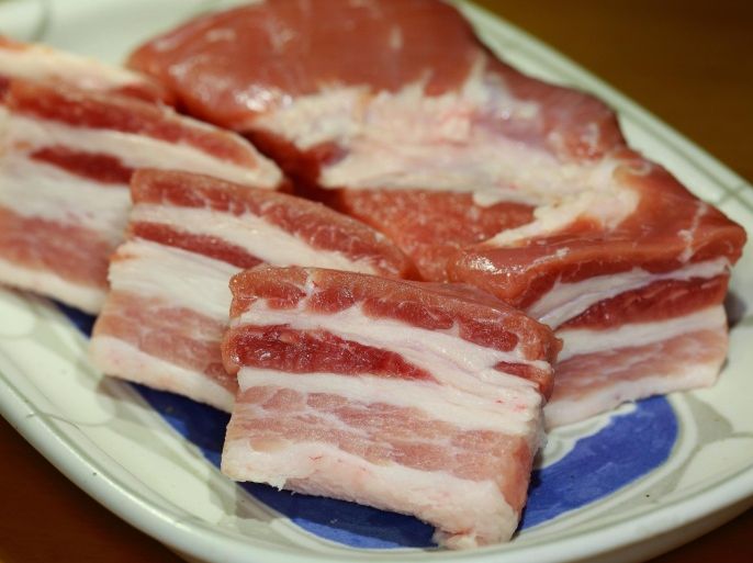 Close up of raw bacon on plate