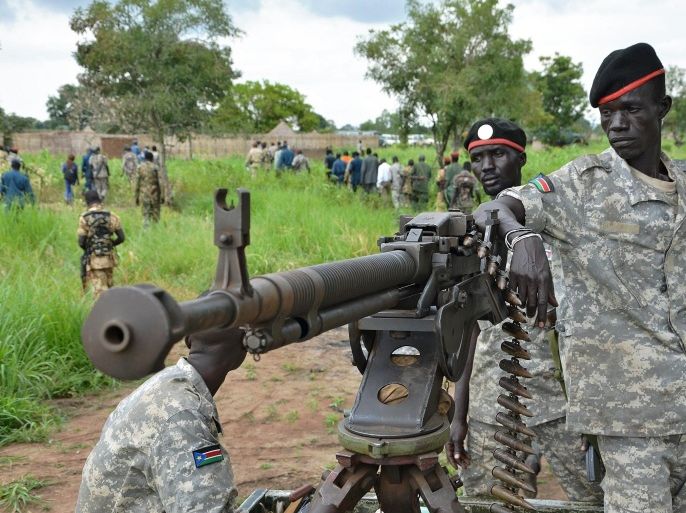 South Sudanese SPLA soldiers are pictured in Pageri in Eastern Equatoria state on August 20, 2015. The spokesman of SPLA, Colonel Philip Aguer visited the area after the government claimed to be back in control of the area following an attack by rebel forces. South Sudan's civil war began in December 2013 when Kiir accused his former deputy Riek Machar of plotting a coup, setting off a cycle of retaliatory killings that has split the poverty-stricken country along ethnic lines. The government says they will return to talks in Ethiopia in early September to 'finalise' a peace deal. AFP PHOTO / SAMIR BOL