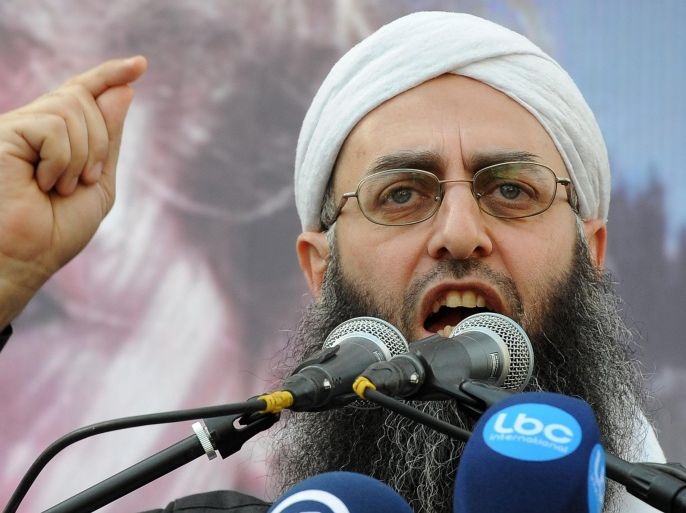 (FILE) A file photo dated 08 February 2013 shows prominent Sunni Muslim Salafist leader, Ahmed al-Assir speaking during a sit-in following Friday prayer in solidarity with the Syrian people and Syrian refugees at Tariq al-Jadidah in Beirut, Lebanon. Media reports on 24 June 2013 said that al-Assir escaped from the complex of the Bilal bin Rabah mosque and that 30 to 40 of his followers were killed in the clashes in the district of Abra in the southern port city. At least 16 soldiers were killed, and 100 civilians injured in the clashes that erupted on 23 June when al-Assir's supporters killed three soldiers at an army checkpoint where a vehicle belonging to his followers had been stopped.