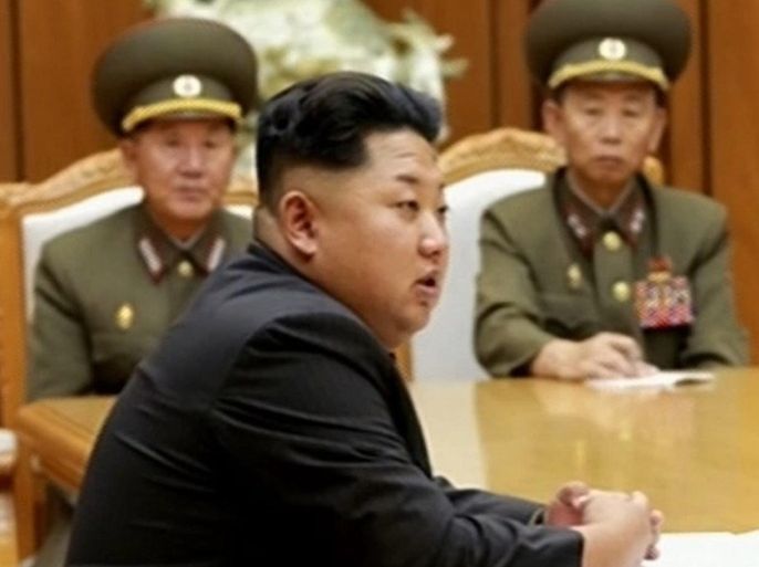 An undated video grab image made and supplied by South Korean agency Yonhap from the Korean Central Television Station on 21 August 2015 showing North Korean leader Kim Jong-un (front) presiding over an emergency meeting of the central military commission of the Workers' Party after both Koreas exchanged fire across the western border 20 August 2015. Kim declared a 'quasi-state of war' and ordered chief commanders to go to front-line troops to prepare for military operations, the broadcaster said.  EPA/KOREAN CENTRAL TELEVISION VIA YONHAP