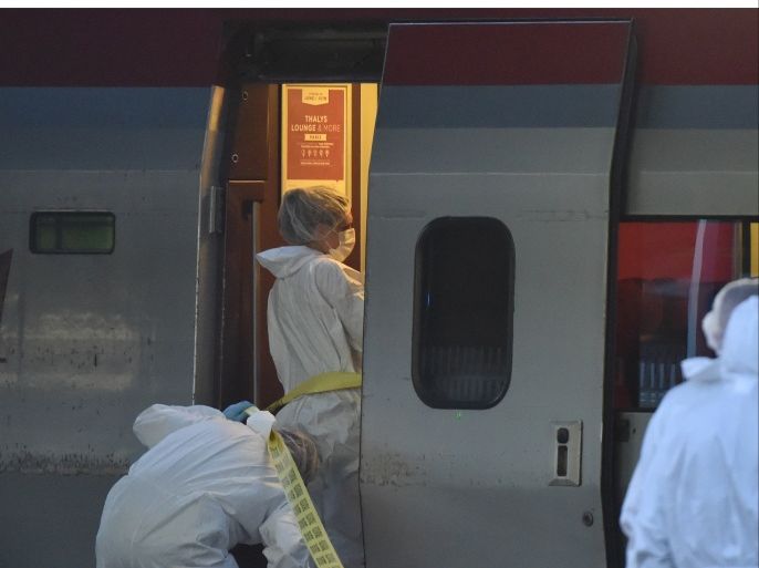 Police arive to inspect the crime scene inside a Thalys train of French national railway operator SNCF at the main train station in Arras, northern France, on August 21, 2015. A gunman opened fire on a train travelling from Amsterdam to Paris, injuring three people before being overpowered by passengers, French state rail company SNCF and rescue services said. Two of the victims were seriously injured and at least one suffered gunshot wounds, an SNCF spokesman said, adding that the assailant was armed with guns and knives. The motives behind the attack were not immediately known. AFP PHOTO / PHILIPPE HUGUEN