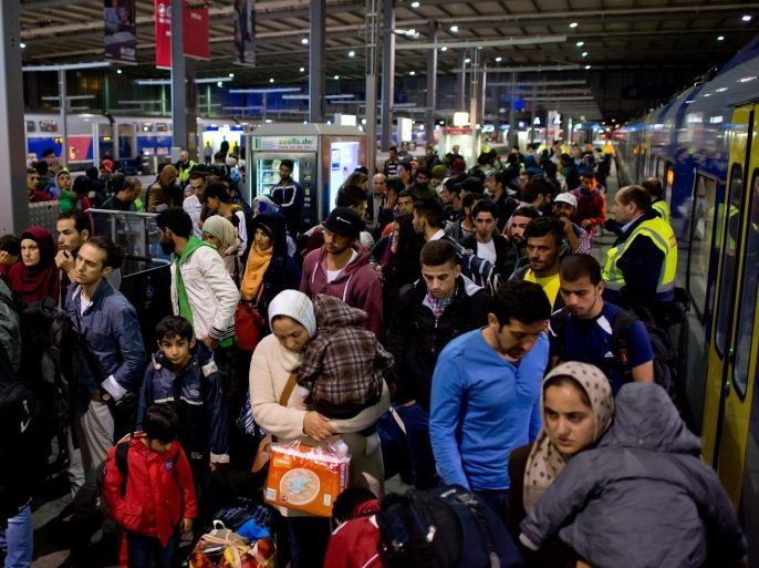 Recently arrived refugees at the main station in Munich, Germany, 13 September 2015. About 13,00 refugees were expected to reach Munich's main railway station on 12 September, as local officials warned of a lack of accommodation for the new arrivals in the Bavarian capital.