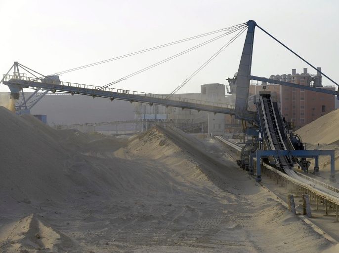 A picture taken on May 13, 2013 shows untreated phosphate being dropped off on a montain at the end of a conveyor belt at the Marca factory of the National Moroccan phosphates company (OCP/public), near Laayoune, the capial of Moroccan-controlled Western Sahara. As a global leader in the market for phosphate and its derivatives, OCP has been a key player in the international market since its founding in 1920, the worlds largest exporter of phosphate rock and phosphoric acid and one of the worlds largest fertilizer producers.