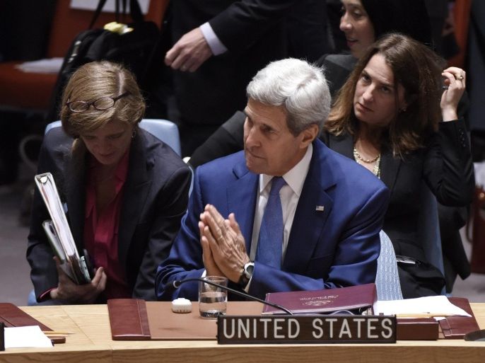 John Kerry (C), the United States' Secretary of State, talks with Samantha Power (L), the United States' ambassador to the United Nations, during a Security Council meeting about international peace and security during the 70th session General Debate of the United Nations General Assembly at United Nations headquarters in New York, USA, 30 September 2015. Others are not identified.