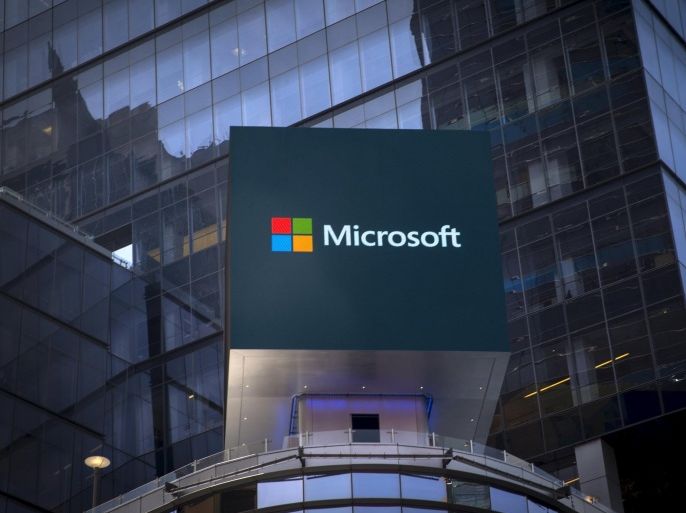 The Microsoft logo is seen on an electronic billboard on an office building in New York City, July 28, 2015. The global launch of the Microsoft Windows 10 operating system will take place on July 29. REUTERS/Mike Segar