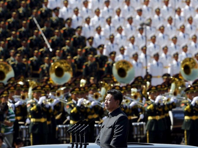Chinese President Xi Jinping reviews the army lined at Tiananmen Square at the beginning of the military parade marking the 70th anniversary of the end of World War Two, in Beijing, China, September 3, 2015 REUTERS/Damir Sagolj