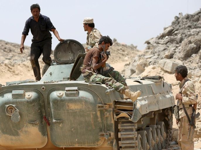 Soldiers loyal to Yemen's government ride on an armoured vehicle in the frontline province of Marib, September 20, 2015. REUTERS/Stringer