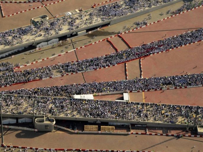 In this image released by the Saudi Press Agency (SPA), hundreds of thousands of Muslim pilgrims make their way to cast stones at a pillar symbolizing the stoning of Satan in a ritual called "Jamarat," the last rite of the annual hajj, on the first day of Eid al-Adha, in Mina on the outskirts of the holy city of Mecca, Saudi Arabia, Thursday, Sept. 24, 2015. (Saudi Press Agency via AP)