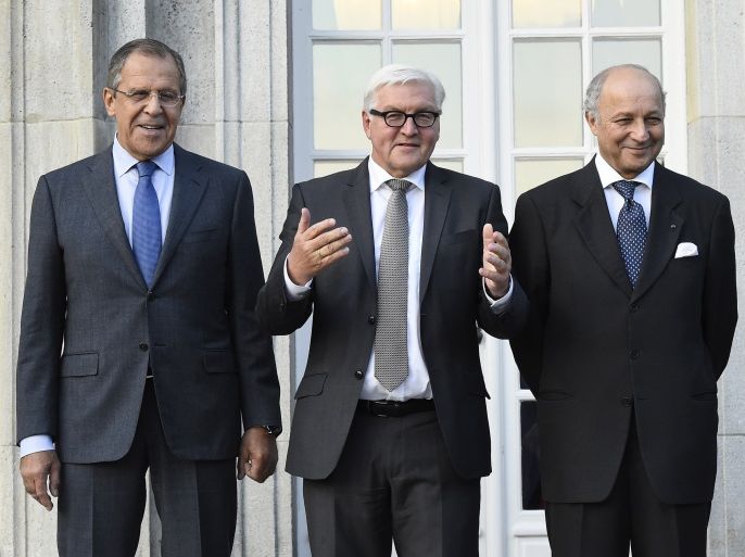 Russian Foreign Minister Sergei Lavrov (L-R), German Foreign Minister Frank-Walter Steinmeier, French Foreign minister Laurent Fabius and Ukrainian Foreign Minister Pavlo Klimkin pose for a picture ahead of their meeting at the foreign ministry's Villa Borsig at lake Tegel in Berlin September 12, 2012. AFP PHOTO / POOL / TOBIAS SCHWARZ