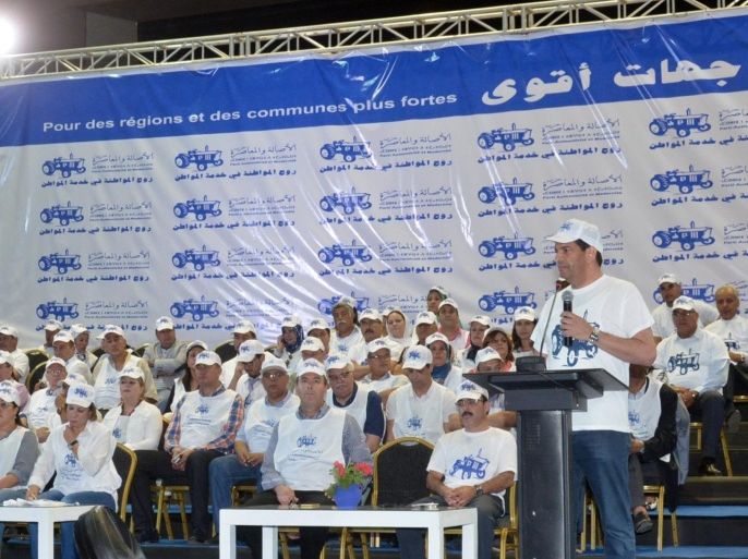 The secretary general of the Authenticity and Modernity Party (PAM), Mustapha Bakkoury (R) gives a speech during a meeting of his party to launch the campaign ahead of the municipal and regional elections on August 22, 2015 in the Moroccan capital Rabat. The campaign starts officially and will run until the eve of the elections to be held on September 4, 2015. AFP PHOTO / STR