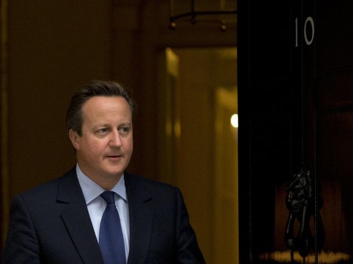 British Prime Minister David Cameron walks out to meet Danish Prime Minister Lars Loekke Rasmussen for their meeting at 10 Downing Street, London, Monday, Sept. 21, 2015. (AP Photo/Matt Dunham)