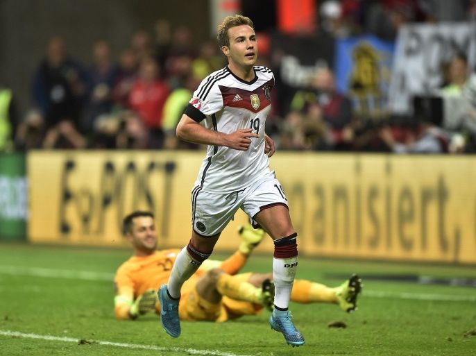 Germany’s Mario Goetze walks past Poland's goalkeeper Lukasz Fabianski after scoring his second goal during the Euro 2016 qualifying match between Germany and Poland in Frankfurt, Germany, Friday, Sept. 4, 2015. Germany defeated Poland with 3-1. (AP Photo/Martin Meissner)