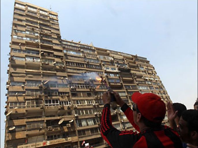Egyptian demonstrators launch a firecracker towards the Israeli embassy in Cairo on August 20, 2011. Egypt decided to recall its ambassador from Israel to protest the deaths of policemen killed on the border,