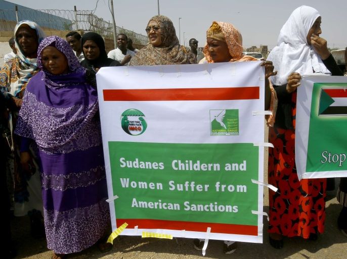 SUDAN : Sudanese representatives of various humanitarian organisations take part in a protest outside the US embassy in Khartoum on September 16, 2015, against the sanctions imposed on the country. Sudan has been under a US trade embargo since 1997 imposed over rights abuses and support for radical Islamist groups in the early 1990s. AFP PHOTO / ASHRAF SHAZLY
