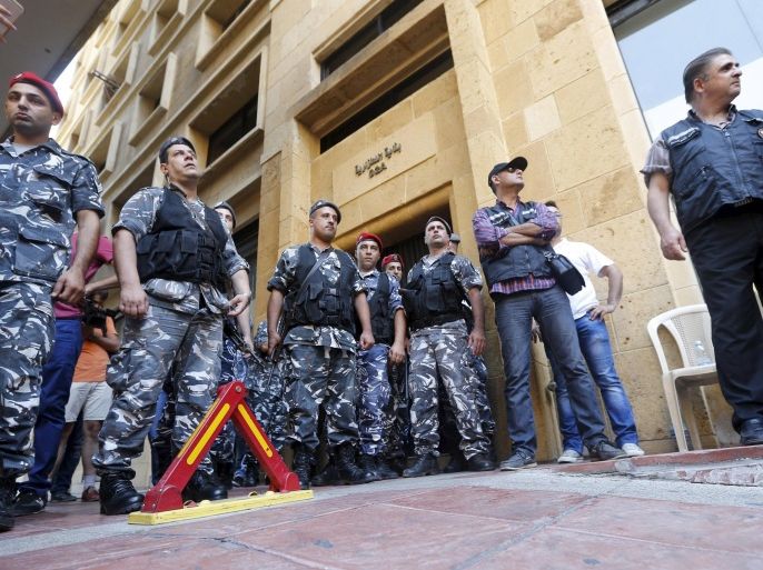 Security officers stand guard at the entrance of the environment ministry in downtown Beirut, Lebanon September 1, 2015. Dozens of Lebanese protesters staged a sit-in inside the environment ministry in the capital Beirut on Tuesday, calling on minister Mohammad Machnouk to resign, a Reuters witness said. Lebanon has been hit by a series of protests against the government ignited by a dispute over uncollected rubbish in the country. REUTERS/Mohamed Azakir