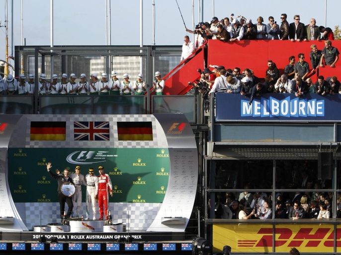 (L to R) Mercedes-Benz head of development Thomas Weber, second placed Mercedes Formula One driver Nico Rosberg of Germany, race winner Mercedes Formula One driver Lewis Hamilton of Britain and third placed Ferrari Formula One driver Sebastian Vettel of Germany pose on the podium after the Australian F1 Grand Prix at the Albert Park circuit in Melbourne March 15, 2015. REUTERS/Brandon Malone (AUSTRALIA - Tags: SPORT MOTORSPORT F1 BUSINESS TPX IMAGES OF THE DAY)