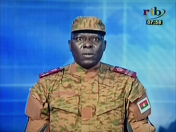A picture taken on September 17, 2015 shows a TV screen during the broadcast of the speech of Lieutenant-colonel Mamadou Bamba announcing that a new "National Democratic Council" had put an end "to the deviant regime of transition" in the west African state and Burkina's interim president had been stripped of his powers. Burkina Faso's presidential guard on September 16, 2015 detained the interim president and prime minister, plunging the west African country into uncertainty just weeks before the first elections since the ouster of ex-leader Blaise Compaore. AFP PHOTO/ ISSOUF SANOGO