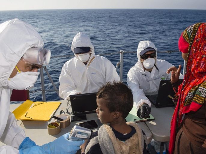 A handout picture provided by the Marine Nationale Francaise (French Navy) on 07 September 2015 shows the French Navy crew of the 'Commandant Bouan' patrol vessel registering rescued migrants during the EU sea patrol mission Triton/Frontex, from southern Italy to southern Malta, in the Mediterranean Sea, on 05 September 2015. The 'Commandant Bouan' patrol vessel, engaged in the Triton/Frontex mission since 31 August 2015, rescued more than 320 people during this operation. EPA/SEBASTIEN CHENAL/MARINE NATIONALE/HANDOUT HANDOUT EDITORIAL USE ONLY/NO SALES