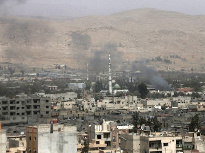 Smoke rises during clashes between forces loyal to Syria's President Bashar al-Assad and the Army of Islam fighters, on the eastern mountains of Qalamoun overlooking the town of Douma, eastern Ghouta in Damascus September 14, 2015. Picture taken September 14, 2015. REUTERS/Bassam Khabieh