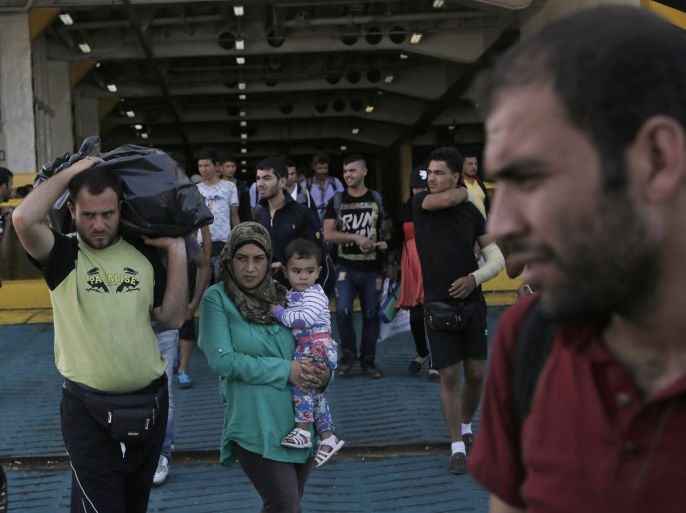Refugees, mostly from Syria, disembark the ferry 'Eleftherios Venizelos' at the port of Piraeus, near Athens, Greece, 08 September 2015. The ships 'Eleftherios Venizelos' and 'Diagoras' arrived in the port of Piareus carrying about 3,000 refugees who had landed on the Greek islands of Lesvos and Kos, coming from Turkey. An estimated 20,000 refugees arrived on the Greek islands in the last week, reports say.