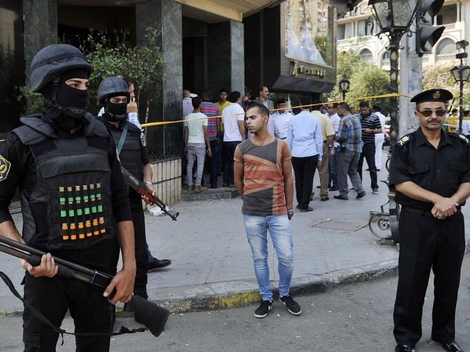 Members of the Egyptian security services stand guard at the site of a small blast in Roxy Square, Heliopolis, Cairo, Egyt, 16 July 2015. According to local reports, one police officer is receiving treatment in hospital for wounds received when a small homemade bomb detonated in a Cairo district. The attack coming after two high profile bombings in the Egyptian capital, one killing the country's Prosecutor General and another destroying the facade of the Italian consulate. Egypt has experienced high levels of insecurity, especially in the Sinai peninsula, where 16 July a group claiming affiliation to the organisation calling themselves the Islamic State (IS) claim to have attacked an Egyptian Naval frigate with an anti tank weapon as it lay off the northern coast of the peninsula.