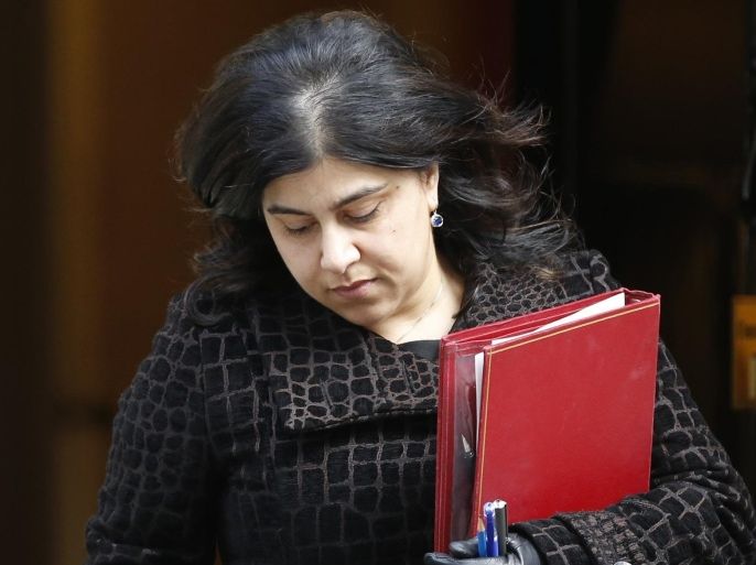 File photograph shows British Senior Minister of State at the Foreign and Commonwealth Office, Sayeeda Warsi, leaving 10 Downing Street after a Cabinet meeting in central London March 4, 2014. Warsi tendered her resignation on August 5, 2014, saying that she can no longer support the government's policy on Gaza. REUTERS/Olivia Harris/Files (BRITAIN - Tags: POLITICS MILITARY CONFLICT) - RTX12ZX0