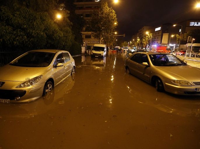 Cars are seen on a flooded street on October 03, 2015 in Nice, southeastern France. AFP PHOTO / VALERY HACHE