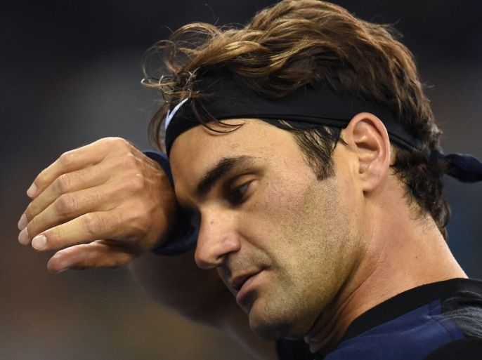 Roger Federer of Switzerland reacts during his men's singles second round match against Albert Ramos-Vinolas of Spain at the Shanghai Masters tennis tournament in Shanghai on October 13, 2015. AFP PHOTO / JOHANNES EISELE