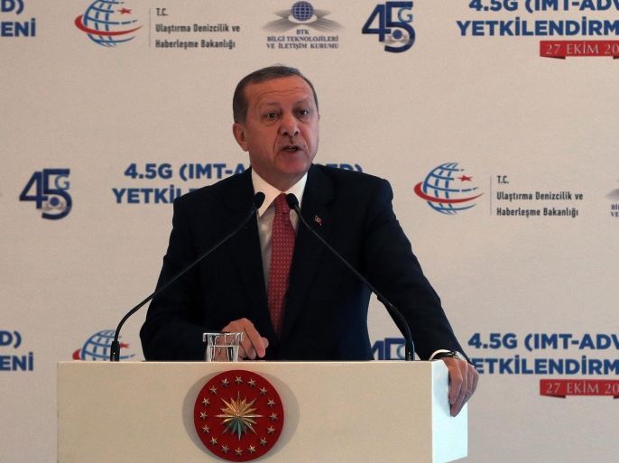 Turkey's President Recep Tayyip Erdogan addresses a technology meeting in Ankara, Turkey, Tuesday, Oct. 27, 2015. Critics accuse Erdogan of organizing rallies in Turkey and Europe to drum up votes for the ruling Justice and Development Party before Nov. 1 general elections, in breach of laws that require him to be neutral.(AP Photo/Burhan Ozbilici)