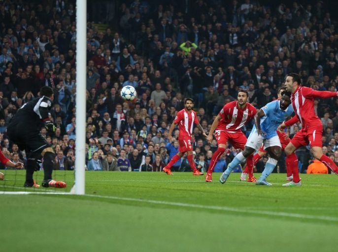 Manchester City's Wilfried Bony (2-R) heads to score during the UEFA Champions League group D soccer match between Manchester City and FC Sevilla held at the Etihad Stadium in Manchester, Britain, 21 October 2015.