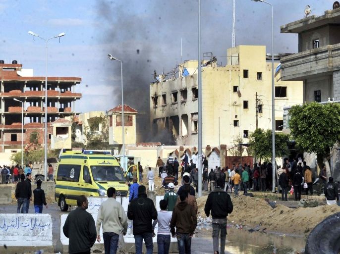 Egyptians gather at the site of a massive bomb attack on one of the main police stations in al-Arish, Sinai, Egypt, 12 April 2015. According to local reports at least six people were killed and as many as 40 others wounded in a massive explosion targeting the station, coming the same day as six soldiers were also killed in an attack south of al-Arish, the latest in a series of attacks on the Egyptian military, which has been accused by some of killing 12 civilians in a recent incident.