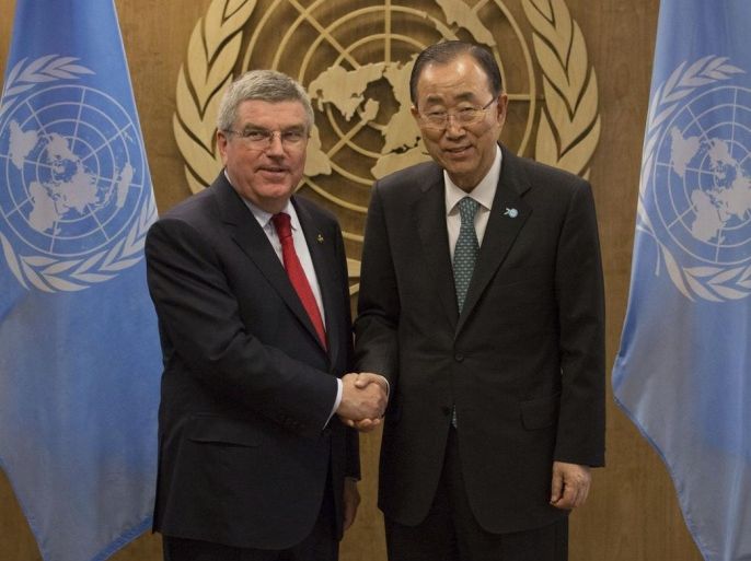 International Olympic Committee President Thomas Bach, left, shakes hands with United Nations Secretary-General Ban Ki-moon during a meeting at the United Nations headquarters Sunday, Sept. 27, 2015. (AP Photo/Kevin Hagen)