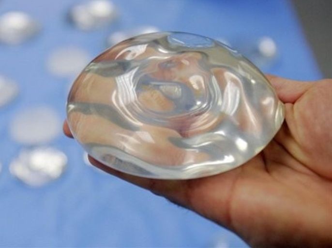 FILE - In this Dec. 11, 2006 file photo, a silicone gel breast implant is shown at Mentor Corp., a subsidiary of Johnson & Johnson, in Irving, Texas. Federal health officials say the latest data on silicone breast implants show they are relatively safe, despite frequent complications that lead about one in five women to have the implants removed within ten years.