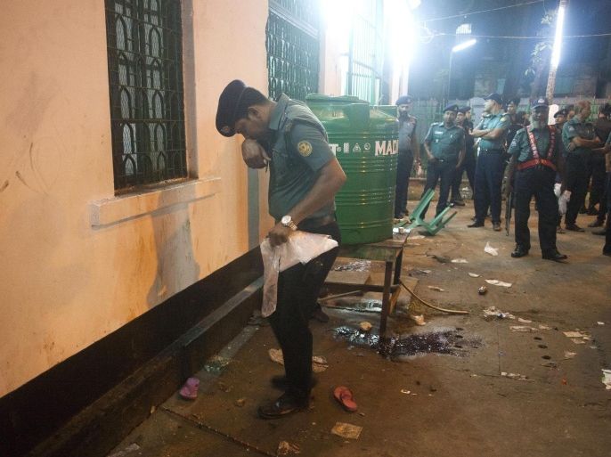 A security official inspects the scene of a bomb blast at Hoseni Dalan in Dhaka, Bangladesh, 24 October 2015. At least one person was killed and some 80 were injured in a triple explosion of improvised explosive devices when members of the Shia community were gathering at the building in Old Dhaka for a procession marking the day of Ashura.