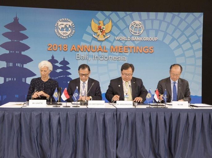 International Monetary Fund Managing Director Christine Lagarde (L), World Bank President Jim Yong Kim (R), Bank Indonesia Governor Agus D.W. Martowardojo (2nd L) and Indonesia's Finance Minister Bambang Brodjonegoro (2nd R) sign the documents to hold the IMF/World Bank Annual Meetings in 2018 in Bali, Indonesia, during the IMF/World Bank Annual Meetings at the Lima Convention Center in Lima, Peru, October 10, 2015. REUTERS/Stephen Jaffe/IMF Staff/Handout via Reuters ATTENTION EDITORS - THIS PICTURE WAS PROVIDED BY A THIRD PARTY. REUTERS IS UNABLE TO INDEPENDENTLY VERIFY THE AUTHENTICITY, CONTENT, LOCATION OR DATE OF THIS IMAGE. FOR EDITORIAL USE ONLY. NOT FOR SALE FOR MARKETING OR ADVERTISING CAMPAIGNS. THIS PICTURE IS DISTRIBUTED EXACTLY AS RECEIVED BY REUTERS, AS A SERVICE TO CLIENTS.