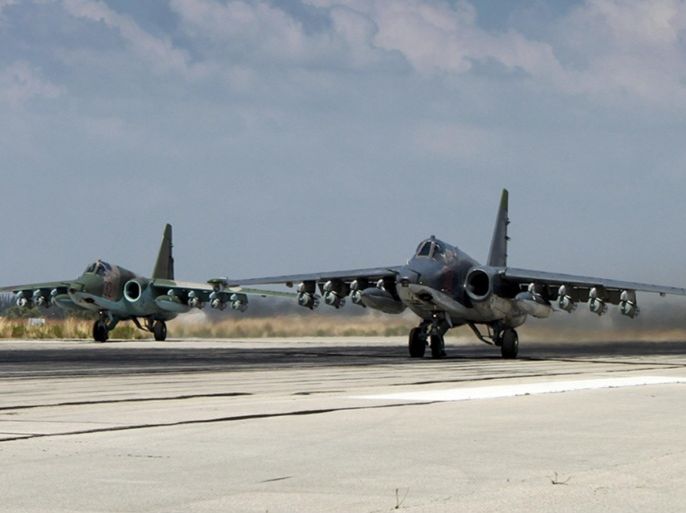 In this photo made from the footage taken from Russian Defense Ministry official web site on Tuesday, Oct. 6, 2015, two Russian SU-25 ground attack aircrafts take off from an airbase Hmeimim in Syria. A spokeswoman for the Russian foreign ministry has rejected claims that Russia in its airstrikes in Syria is targeting civilians or opposition forces. (Russian Defense Ministry Press Service via AP)