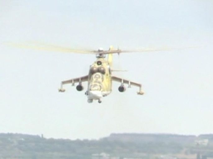 A still image taken from a October 6, 2015 footage shows a Russian air force helicopter flying at Heymim air base near the Syrian port town of Latakia. The Syrian army and allied militia carried out ground attacks on insurgent positions in Syria on Wednesday backed by Russian air strikes, in what appeared to be their first major coordinated assault since Moscow intervened last week, a monitor said. REUTERS/RURTR via Reuters TV ATTENTION EDITORS - THIS IMAGE HAS BEEN SUPPLIED BY A THIRD PARTY. IT IS DISTRIBUTED, EXACTLY AS RECEIVED BY REUTERS, AS A SERVICE TO CLIENTS. REUTERS IS UNABLE TO INDEPENDENTLY VERIFY THE AUTHENTICITY, CONTENT, LOCATION OR DATE OF THIS IMAGE. FOR EDITORIAL USE ONLY. NOT FOR SALE FOR MARKETING OR ADVERTISING CAMPAIGNS. NO SALES. NO ARCHIVES. RUSSIA OUT. NO COMMERCIAL OR EDITORIAL SALES IN RUSSIA