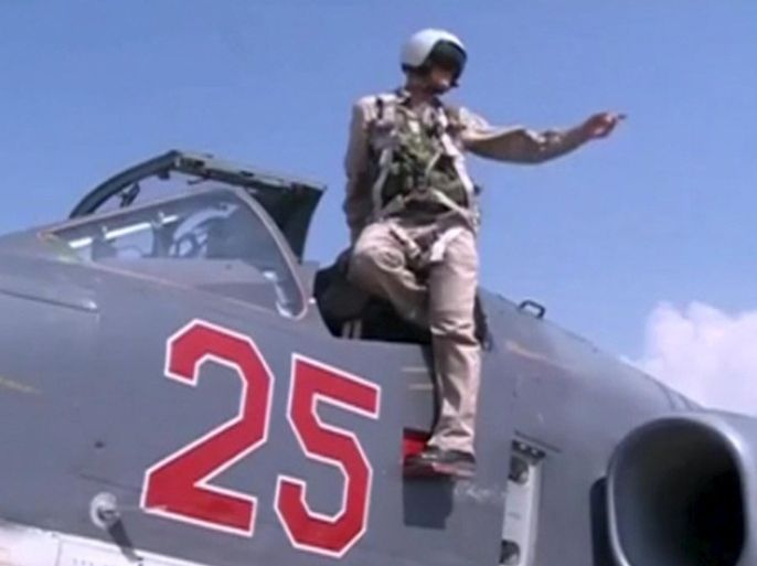 A frame grab taken from footage released by Russia's Defence Ministry October 5, 2015, shows a pilot gesturing from a Russian air force Su-25 military jet on the tarmac of Heymim air base in Syria. More than 40 Syrian insurgent groups including the powerful Islamist faction Ahrar al-Sham have called on regional states to forge an alliance against Russia and Iran in Syria, accusing Moscow of occupying the country and targeting civilians. REUTERS/Ministry of Defence of the Russian Federation/Handout via Reuters  ATTENTION EDITORS - FOR EDITORIAL USE ONLY. NOT FOR SALE FOR MARKETING OR ADVERTISING CAMPAIGNS. THIS IMAGE HAS BEEN SUPPLIED BY A THIRD PARTY. IT IS DISTRIBUTED, EXACTLY AS RECEIVED BY REUTERS, AS A SERVICE TO CLIENTS. REUTERS IS UNABLE TO INDEPENDENTLY VERIFY THE AUTHENTICITY, CONTENT, LOCATION OR DATE OF THIS IMAGE. FOR EDITORIAL USE ONLY. NO SALES.
