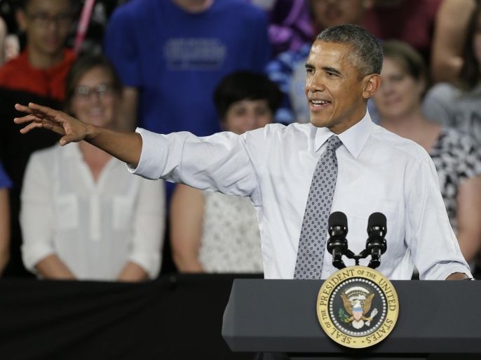 President Barack Obama speaks during a town hall meeting, Monday, Sept. 14, 2015, at North High School in Des Moines, Iowa. (AP Photo/Charlie Neibergall)