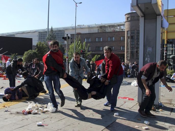 ATTENTION EDITORS - VISUAL COVERAGE OF SCENES OF INJURY OR DEATH People carry an injured man after an explosion during a peace march in Ankara, Turkey, October 10, 2015. At least one explosion shook a road junction in the centre of the Turkish capital Ankara on Saturday, causing many casualties including fatalities, local media said. The state-run Anadolu Agency said there were reports that the blast was caused by a suicide bomber, but the source of those reports was unclear. The blast occurred ahead of a planned "peace" march to protest against the conflict between the state and Kurdish militants in southeast Turkey. Earlier media reports had said there were two explosions. REUTERS/Tumay Berkin