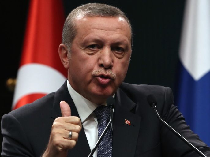Turkish President Recep Tayyip Erdogan speaks to the media during a joint news conference with his Finnish counterpart Sauli Niinisto in Ankara, Turkey, Tuesday, Oct. 13, 2015. Erdogan said Tuesday his country has intelligence suggesting that militants “originating” from Syria were planning to carry out attacks in Turkey but said no terrorist group is being ruled out in the investigation into the weekend’s deadly blasts at a peace rally.(AP Photo/Burhan Ozbilici)