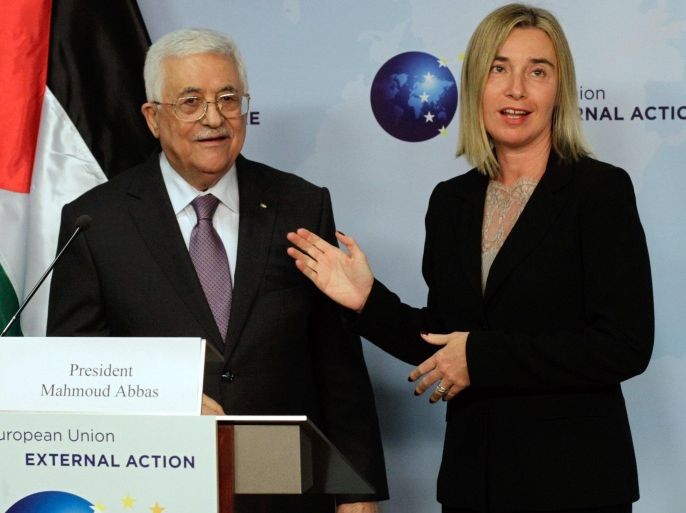 European Union High Representative Federica Mogherini, right, speaks with Palestinian President Mahmoud Abbas prior to a meeting at the EU External Action Service building in Brussels on Monday, Oct. 26, 2015. (AP Photo/Francois Walschaerts)