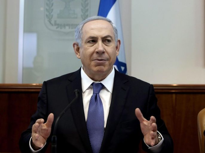 Israeli Prime Minister Benjamin Netanyahu gestures as he opens the weekly cabinet meeting at his Jerusalem office on November 22, 2015.