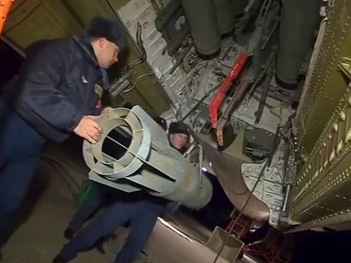 A frame grab taken from a footage released by Russia's Defence Ministry, November 17, 2015, shows Russian ground staff members loading a long-range bomber with weapons at the Hmeymim air base near Latakia, Syria. Russia said on Tuesday it had stepped up air strikes against Islamist militants in Syria with long-range bombers and cruise missiles after the Kremlin said it wanted retribution for those responsible for blowing up a Russian airliner over Egypt. REUTERS/Ministry of Defence of the Russian Federation/Handout via Reuters ATTENTION EDITORS - THIS PICTURE WAS PROVIDED BY A THIRD PARTY. REUTERS IS UNABLE TO INDEPENDENTLY VERIFY THE AUTHENTICITY, CONTENT, LOCATION OR DATE OF THIS IMAGE. EDITORIAL USE ONLY. NOT FOR SALE FOR MARKETING OR ADVERTISING CAMPAIGNS. NO RESALES. NO ARCHIVE. THIS PICTURE IS DISTRIBUTED EXACTLY AS RECEIVED BY REUTERS, AS A SERVICE TO CLIENTS.