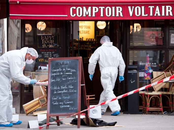 Police forensic experts work on the scene of one the shootings that took place in Paris at the Cafe Comptoir Voltaire in Paris, France, 14 November 2015. At least 120 people have been killed in a series of attacks in Paris on 13 November, according to French officials.