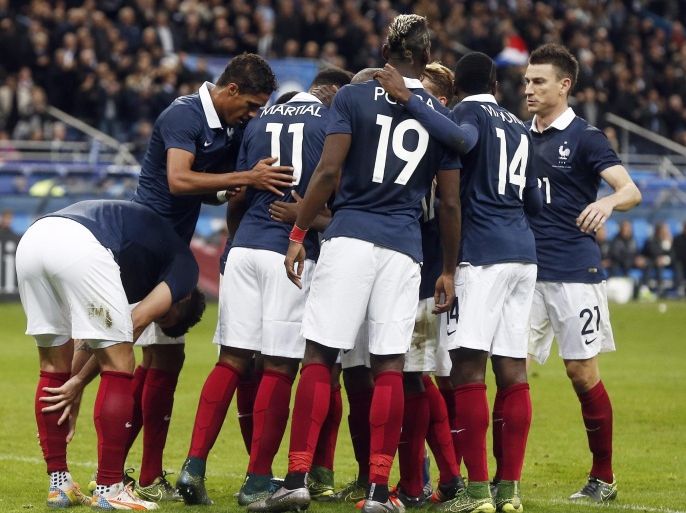 France national soccer team players celebrate scoring the opening goal during the friendly soccer match France vs Germany at the Stade de France, north of Paris, France, 13 November 2015.