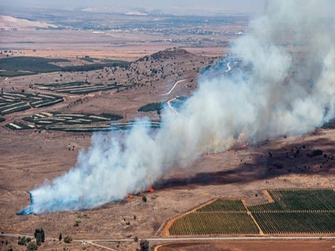 A still image made available on 24 November 2015 from video footage shown by the HaberTurk TV Channel shows smoke billowing from what was described as the crash site of a plane after it was shot down near the Turkish-Syrian border, over north Syria, 24 November 2015. A Russian fighter jet was shot down 24 November over the Turkish-Syrian border, the Defence Ministry in Moscow said, according to Interfax news agency. The Sukhoi Su-24 was reportedly downed by Turkish forces, Turkish state news agency Anadolu reported, citing sources in the presidency. The report said that the jet violated Turkish airspace and ignored warnings. It crashed in the north-western Syrian town of Bayirbucak, Turkish security sources were quoted as saying.  EPA/HABERTURK TV CHANNEL MANDATORY CREDIT: HABERTURK TV CHANNEL